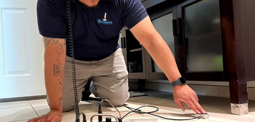 Worker in bathroom on the floor with stethoscope